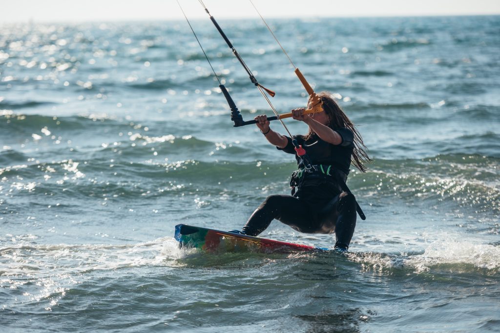 woman kitesurfing on the ocean waters